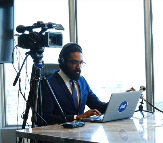 Videographer sits at deposition