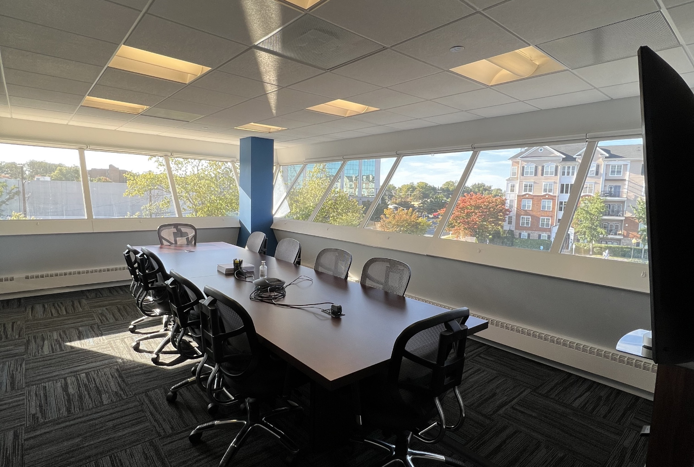 Spacious conference room with multiple windows
