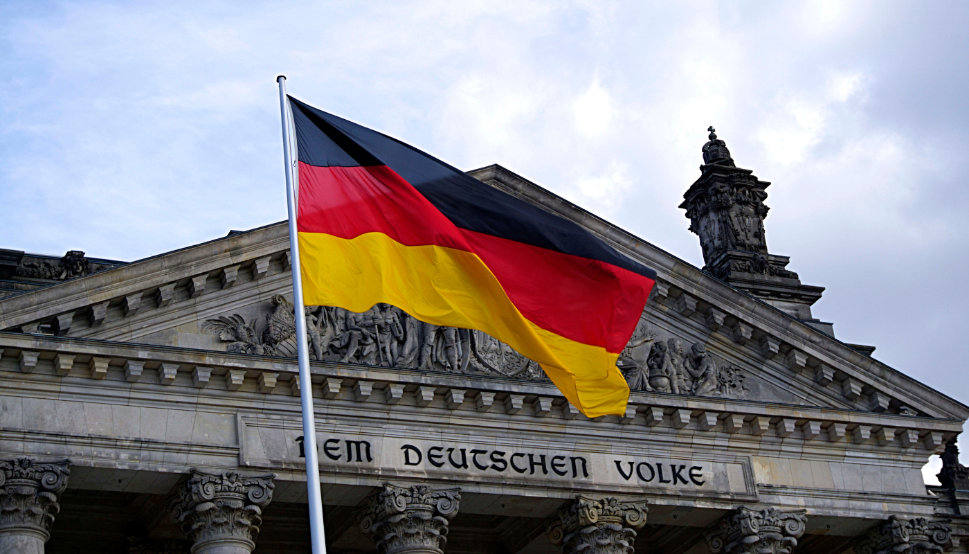 German flag in front of building during international deposition in Germany